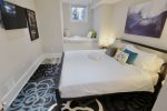 Primary bedroom boasts a king sized bed 